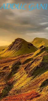 Golden mountains under a dramatic sky in stunning mobile wallpaper.