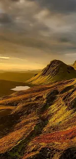 Golden mountain landscape with sunset sky and serene scenery.