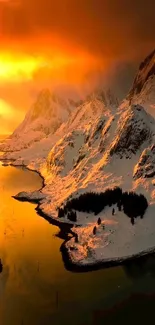 Golden sunset over snow-capped mountains with vibrant sky.