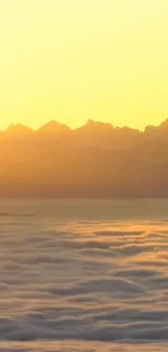 Golden sunrise over misty mountains with a serene, natural landscape.