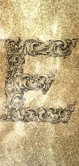 Golden ornate letter 'E' on a textured background.