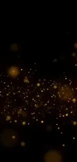 Golden particles on a black background wallpaper.