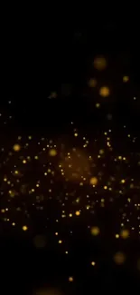 Golden particles on a black background creating an elegant phone wallpaper.