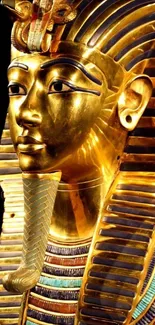 Golden pharaoh mask on black background mobile wallpaper.