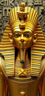 Golden pharaoh statue on ancient Egyptian hieroglyphic background.