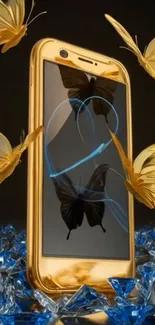 Golden phone with butterflies and blue gems.