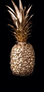 Golden pineapple on a black background, stylish and luxurious design.