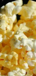 Close-up of golden yellow popcorn, ideal mobile wallpaper for snack enthusiasts.