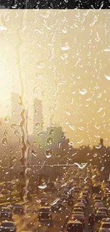 Golden cityscape view with raindrops and sunset glow in the background.