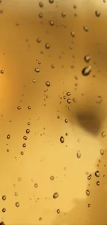 Golden raindrop wallpaper with elegant droplets on a luxurious gold gradient.