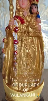 Golden religious statue depicting Our Lady.