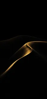 Golden sand dunes gracefully curving in darkness.