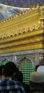 Golden shrine interior with intricate decor and spiritual ambiance.