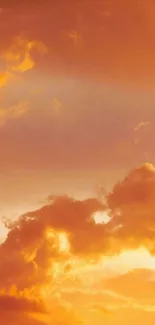 Golden sunset sky with fluffy clouds wallpaper.