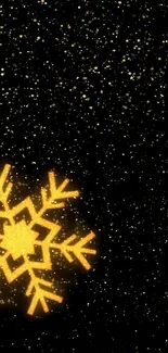 Mobile wallpaper with golden snowflake on black background.