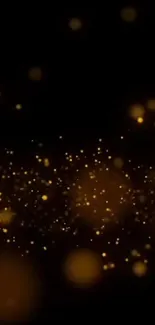 Mobile wallpaper with golden sparkles on a black background.