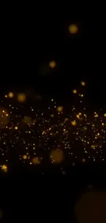 Golden sparkling particles on black background wallpaper.