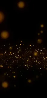 Golden sparkles on black background mobile wallpaper.