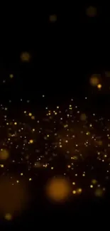 Golden sparkles on black background wallpaper.