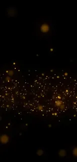 Mobile wallpaper with golden sparkles on a dark background.