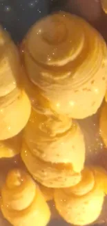 Golden spiral pastries with sparkling highlights.