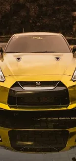 Golden sports car reflected on wet pavement, showcasing luxury and style.