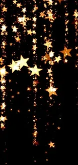 Golden stars cascading against a black background in a night sky wallpaper scene.