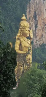 Golden statue surrounded by jungle.