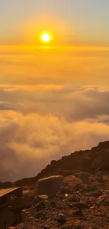 Golden sunrise over a sea of clouds with mountain view.