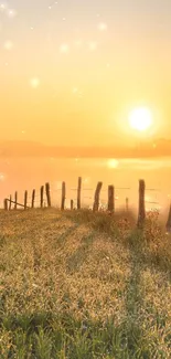 Golden sunrise over a misty countryside landscape with sparkling lights.