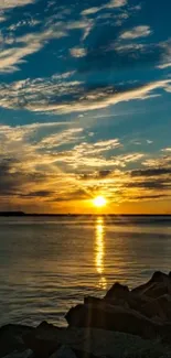 A stunning golden sunrise over a calm ocean with vibrant skies.