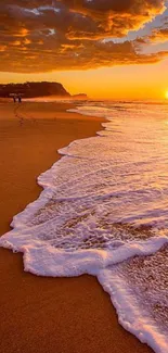 Golden sunset over a tranquil beach with ocean waves.