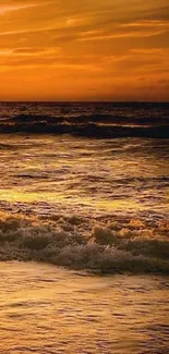 Golden sunset ocean waves at a serene beach, perfect for mobile wallpaper.