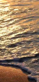 Golden sunset over beach waves with shimmering light.