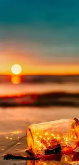 Glowing jar on beach during a golden ocean sunset.