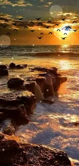 Golden sunset over the ocean with birds flying and rocky coastline.