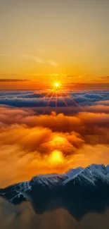 Golden sunset over misty mountains and clouds.