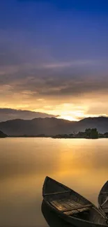 Sunset over lake with two boats on calm water.