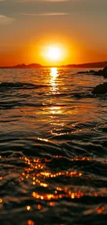 Serene golden sunset over a peaceful ocean.