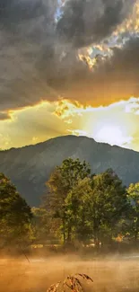 Golden sunset over a tranquil lake with mountainous backdrop.