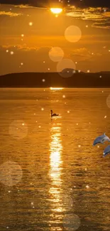 Golden sunset over water with swans and bokeh effect.