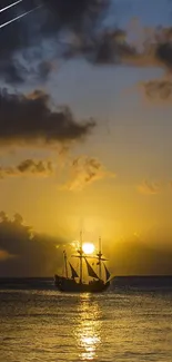 Golden sunset with ship silhouette on the ocean horizon.