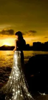 Silhouette of a woman in a sparkling dress at golden sunset over water.