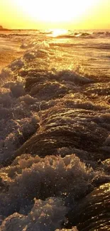 Golden sunset over ocean waves on mobile wallpaper.