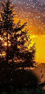 Silhouette of a tree against a golden sunset sky with falling snowflakes.