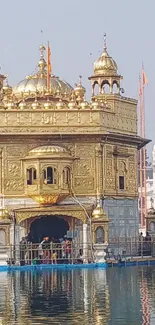 Golden Temple with serene water reflection and intricate architecture.