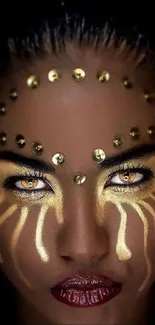 Golden tribal face art with dramatic eyes and intricate patterns.