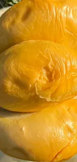 Golden tropical fruit with vibrant yellow tones in close-up view.