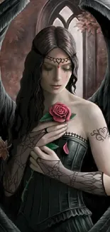 Gothic angel holding a rose with dark wings and intricate tattoos.