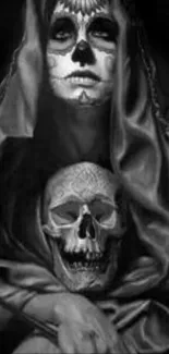 Gothic black and white wallpaper with skull and hooded figure.